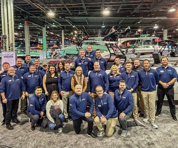 The Boat House team posing together at the 2025 Chicago Boat Show, representing top boating brands and services.