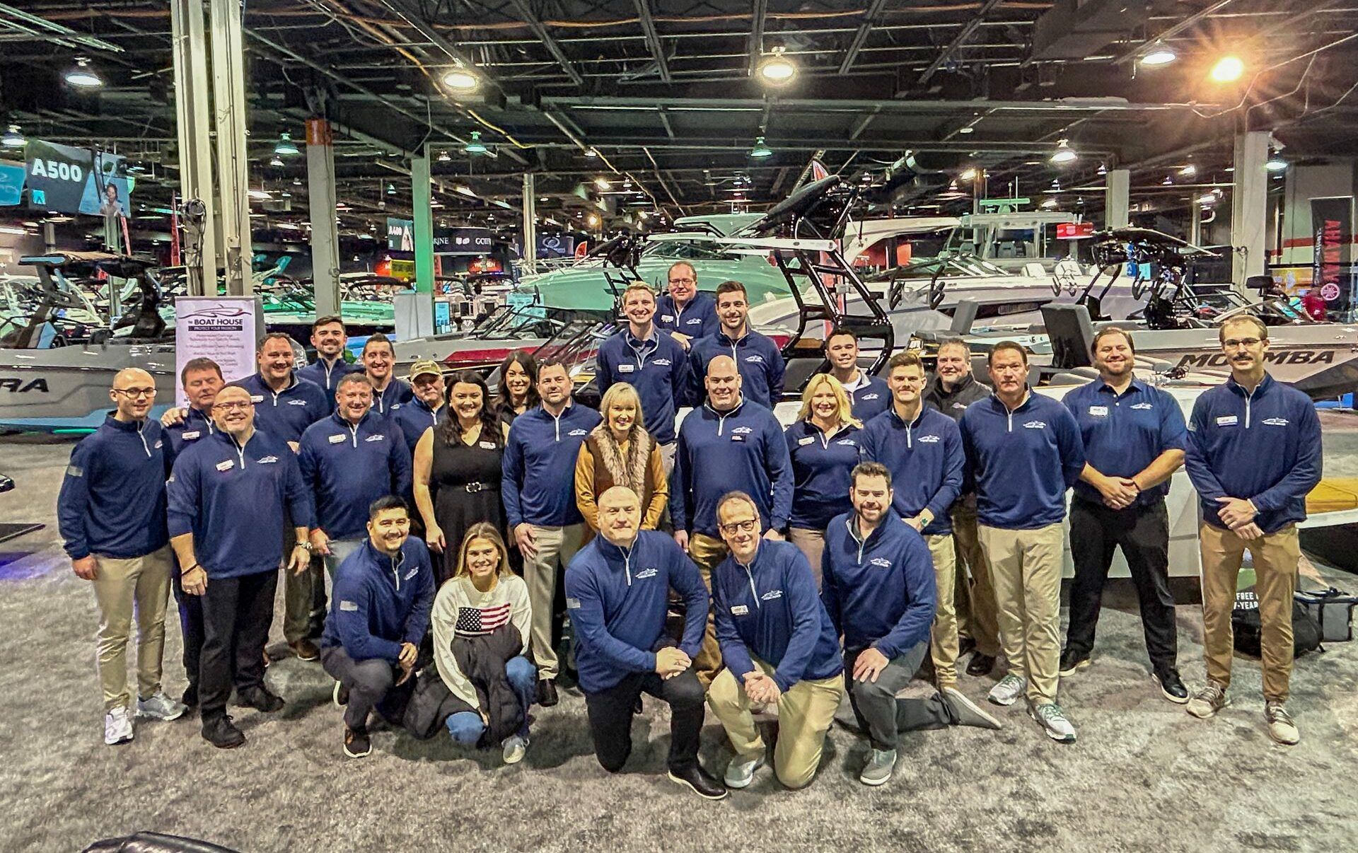 The Boat House team posing together at the 2025 Chicago Boat Show, representing top boating brands and services.