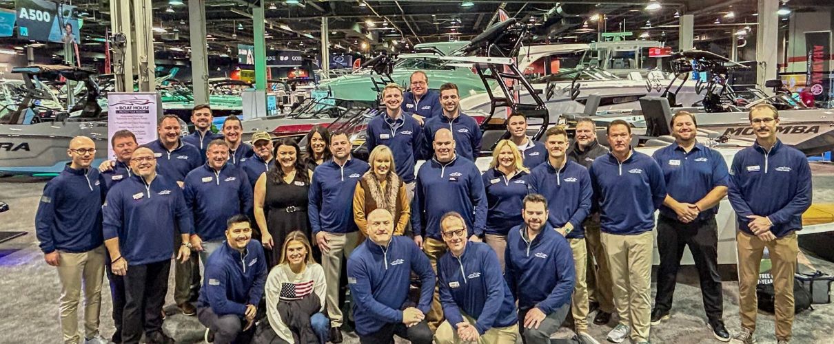 The Boat House team posing together at the 2025 Chicago Boat Show, representing top boating brands and services.