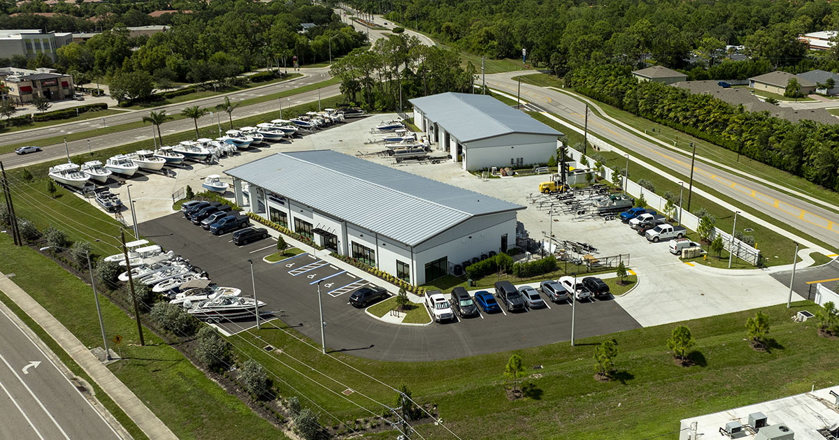 The Boat House Naples Florida dealership — 20,000 sq ft marine facility with indoor service bays